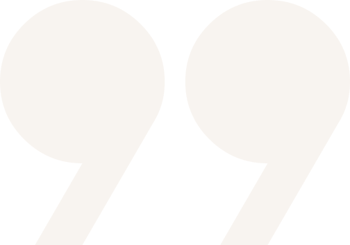Gray quotation marks on black background.