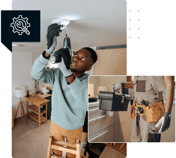 Electrician installing ceiling light with power drill